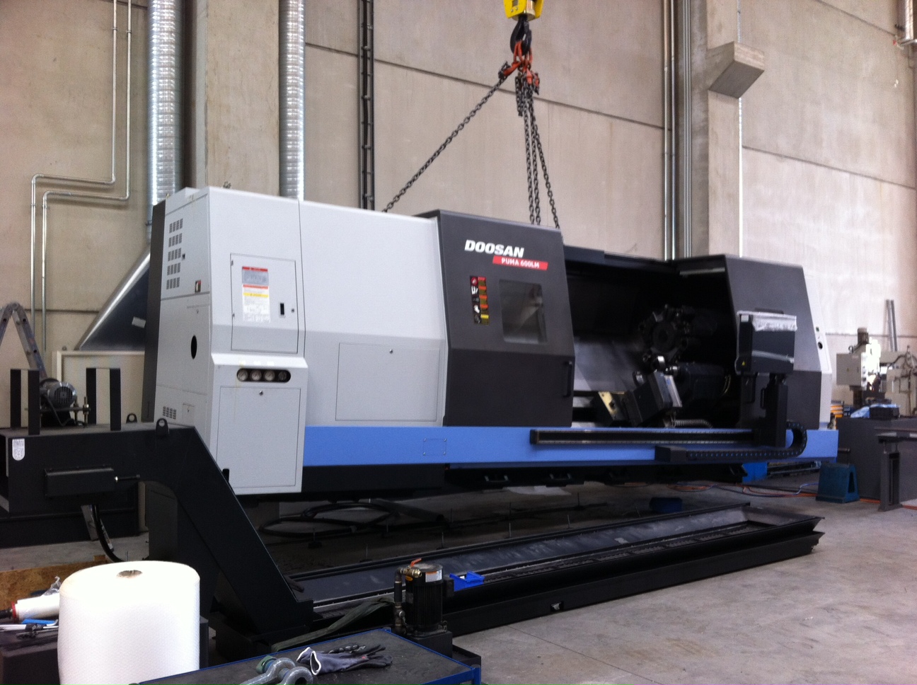 มือสอง Doosan เครื่องกลึง CNC - ถอดประกอบ & กำลังโหลด | Asset-Trade